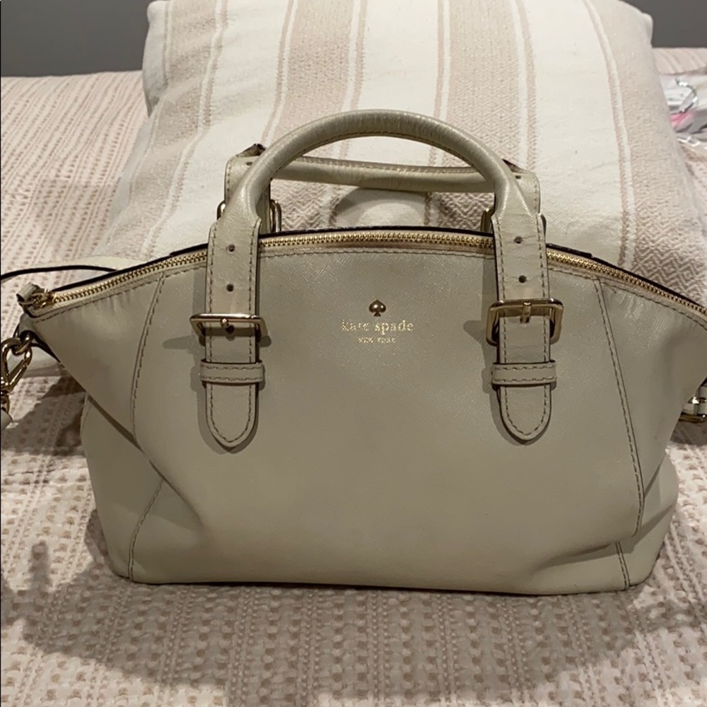 Kate Spade satchel puede in off white.